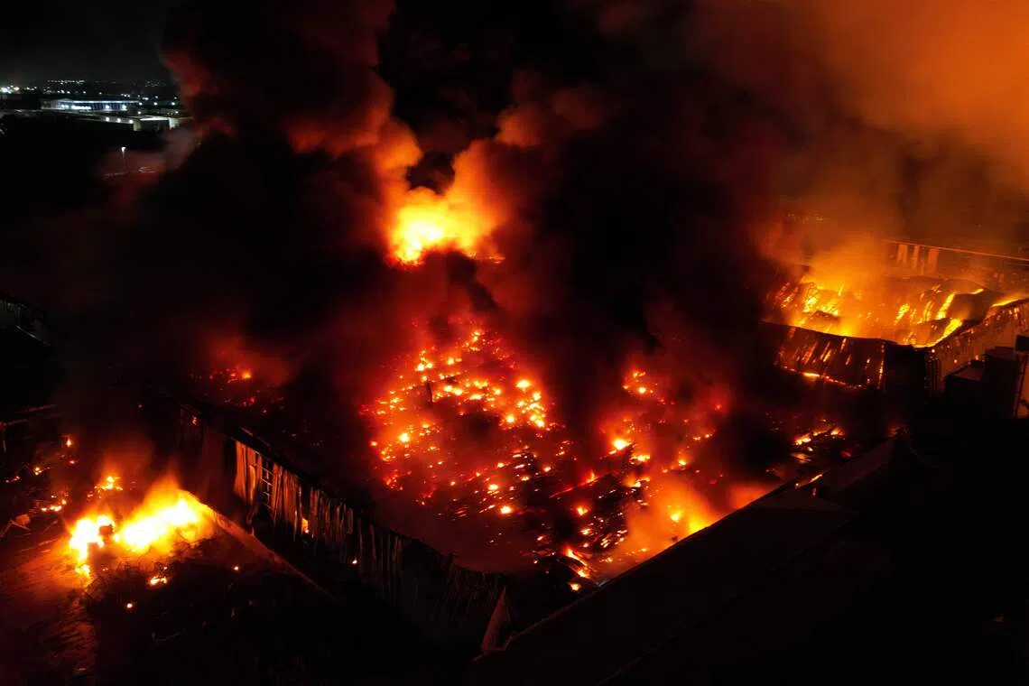 An aerial view showing a fire after an explosion in an industrial area of Ezeiza in Buenos Aires province, Argentina, on Nov 15.