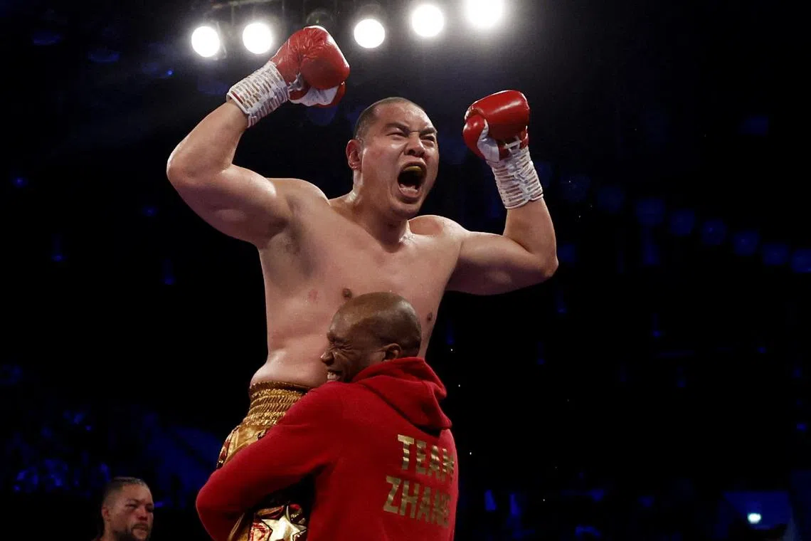 China's Zhang Zhilei celebrates winning his fight against Britain's Joe Joyce at London's Copper Box Arena.