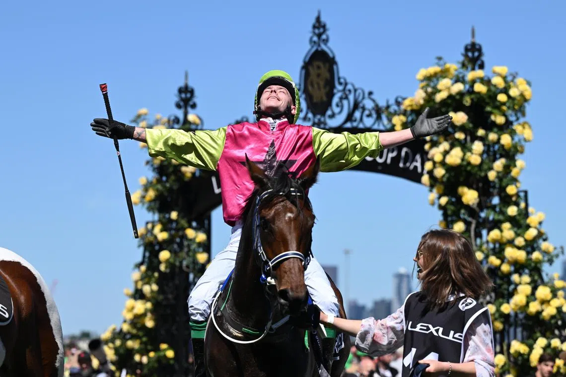 Jockey Robbie Dolan celebrates after riding Knights Choice to victory in the the 2024 Melbourne Cup at Flemington Racecourse.