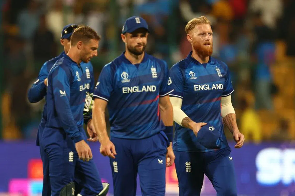 Cricket - ICC Cricket World Cup 2023 - England v Sri Lanka - M. Chinnaswamy Stadium, Bengaluru, India - October 26, 2023 England's Chris Woakes, Jos Buttler and Ben Stokes look dejected after the match REUTERS/Andrew Boyers