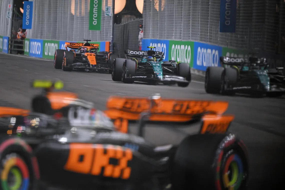 [NOTE: F1 photos are for editorial use only and NOT for sale] Cars in action during the qualifying round of the Formula One Singapore Airlines Singapore Grand Prix at Marina Bay street circuit on September 16, 2023.
