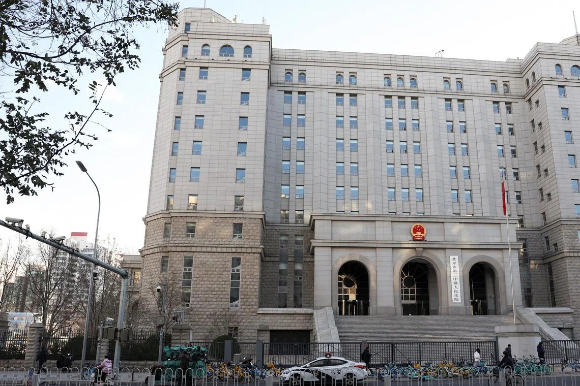 A police vehicle is parked outside Beijing No. 2 Intermediate People's Court, where former Chinese journalist Dong Yuyu is expected to receive his verdict after being detained on espionage charges, in Beijing, China November 29, 2024. REUTERS/Florence Lo