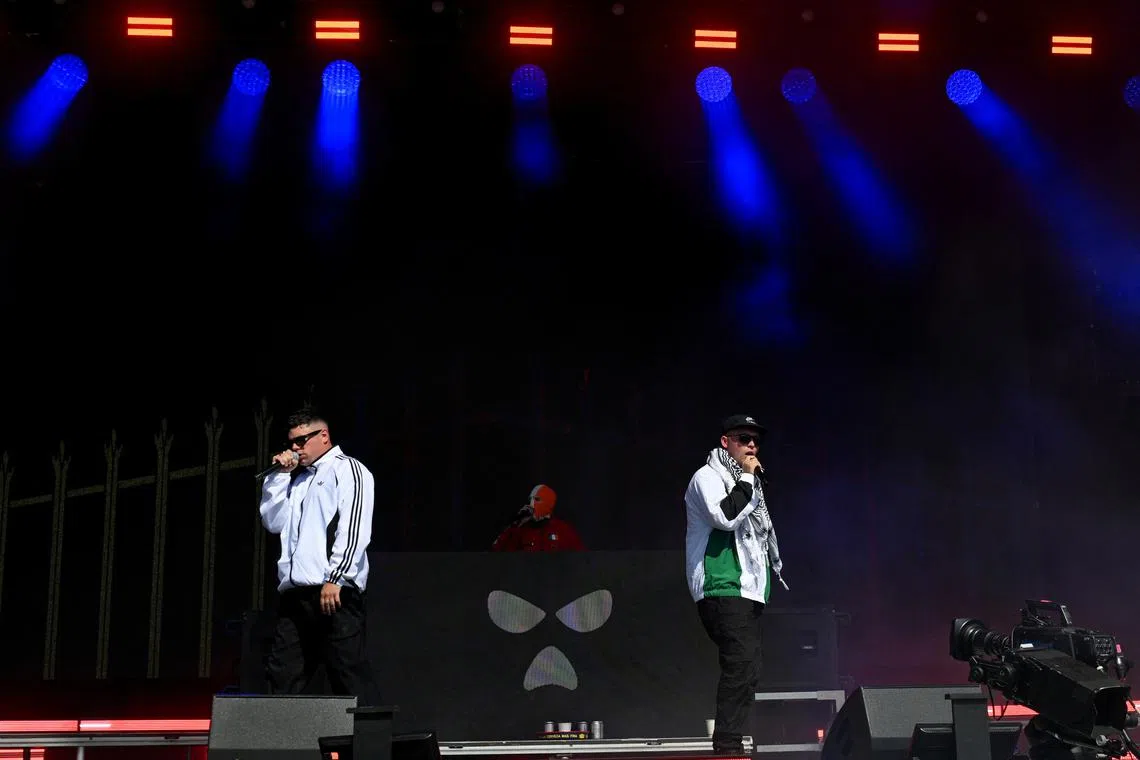 FILE PHOTO: Kneecap performs at Glastonbury Festival at Worthy Farm in Pilton, Somerset, Britain, June 28, 2025. REUTERS/Jaimi Joy/File Photo