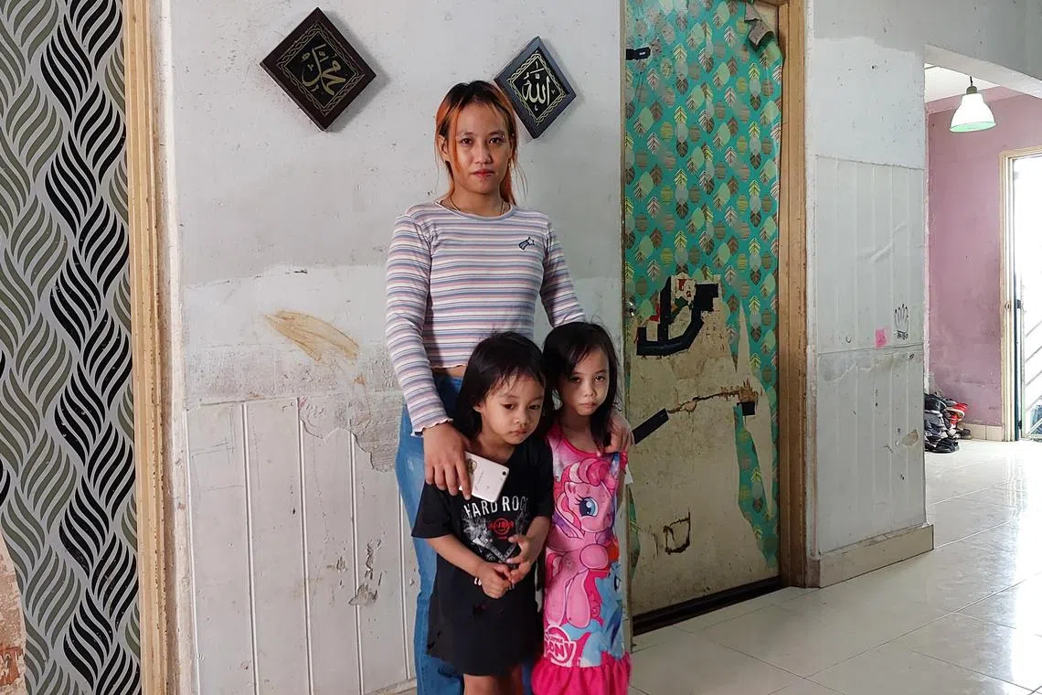 Izzaty Nabella Lau with her two daughters age four and seven. She says she has not received any aid under the goverment's Rahmah scheme. 