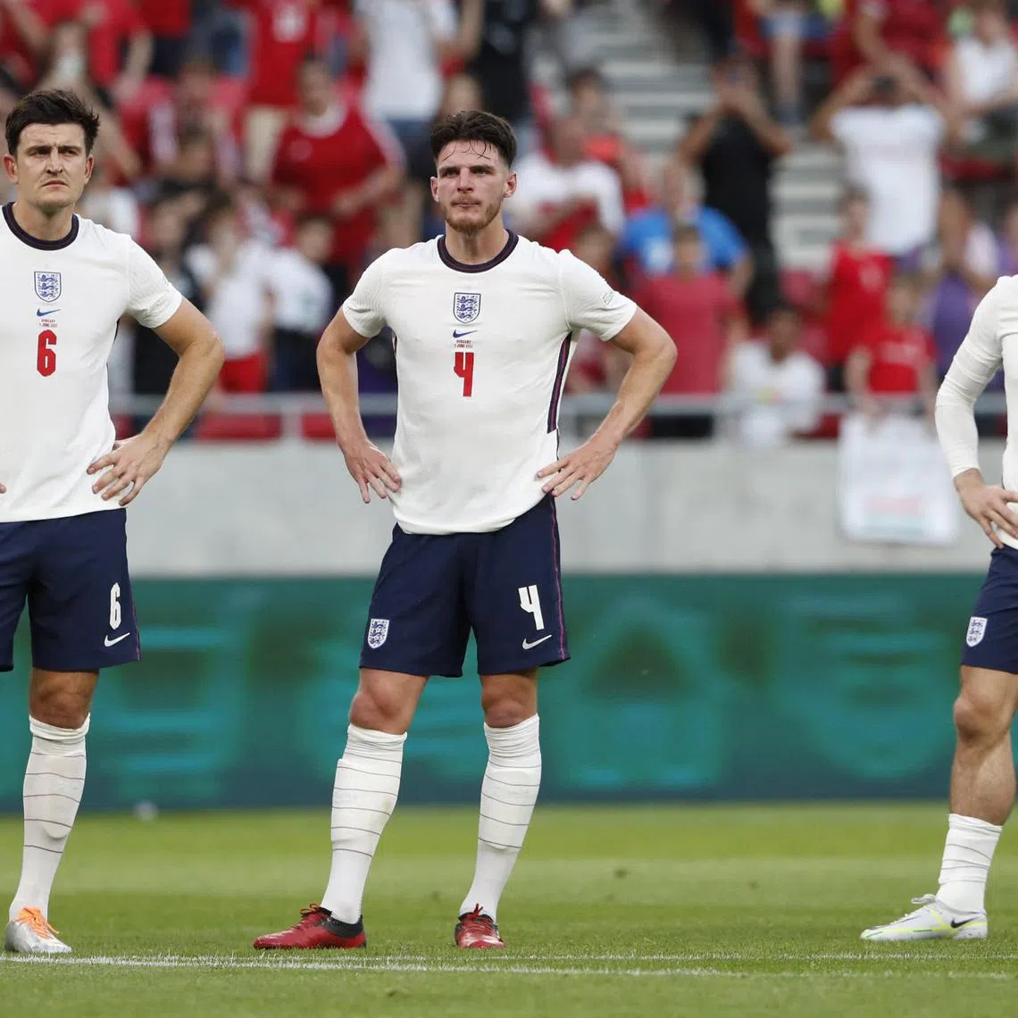 Soccer Football - UEFA Nations League - Group C - Hungary v England - Puskas Arena Park, Budapest, Hungary - June 4, 2022
England's Harry Maguire, Declan Rice and Jack Grealish look dejected after Hungary are awarded a penalty REUTERS/Bernadett Szabo