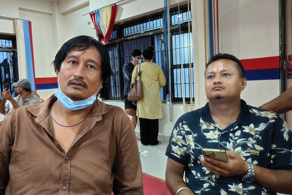 Shiva Khadka (left) has been coming to the temporary body identification camp in Bharatpur daily since it was set up on Aug 27, looking for his missing cousin Santosh Khadka.
