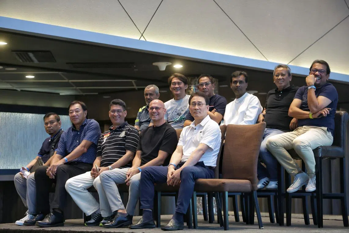 (Front row, from left) 1994 Malaysia league and cup double-winning team's Zakaria Awang, David Lee, Ishamudin Bharoocha, Abbas Saad, Jang Jung, (back row, from left) Malek Awab, Nazri Nasir, Rezal Hassan, T Ramoo, Saswadimata Dasuki, and Rafi Ali watching a video of their winning moments during a celebratory event at Sports Hub's OCBC Lounge on Dec 17, 2024.