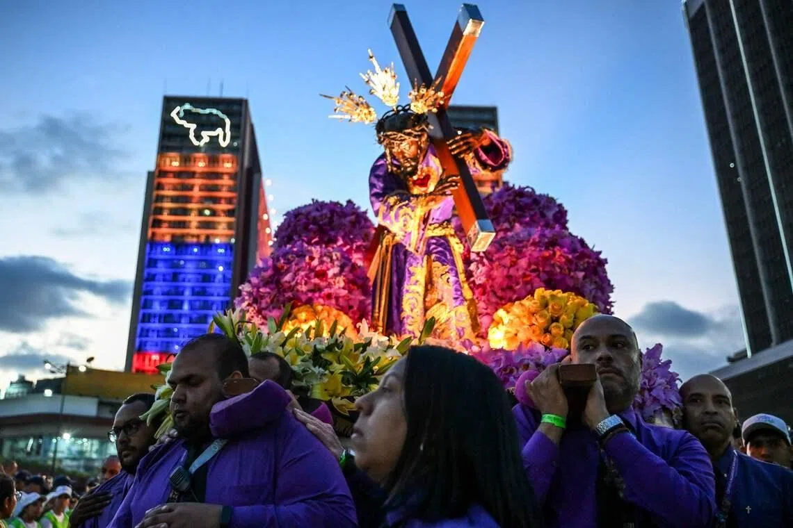 Catholic devotees carrying an image of Jesus Christ in a procession during Holy Week in Caracas, Venezuela on April 1, 2026. 