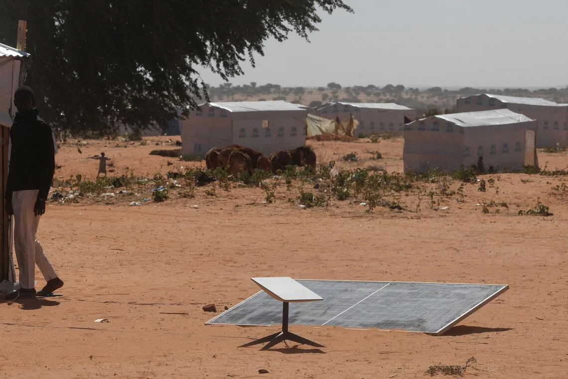 A Starlink antenna powered by a solar panel at a refugee camp in Chad for Sudanese refugees from Darfur.