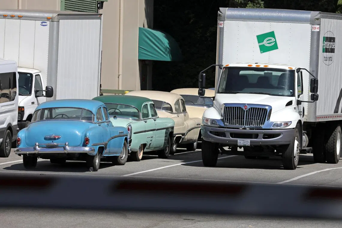 Vintage automobiles are parked in a back lot at North Shore Studios, a "Hollywood North" studio whose business is affected by rare twin strikes by Hollywood actors and film and television writers, in North Vancouver, British Columbia, Canada on July 15, 2023. 