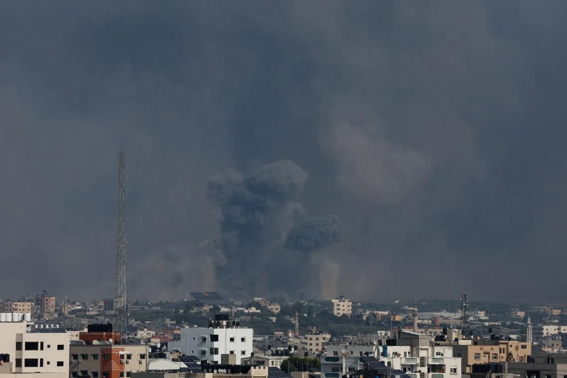 Smoke rising over Gaza following Israeli strikes on Oct 8.