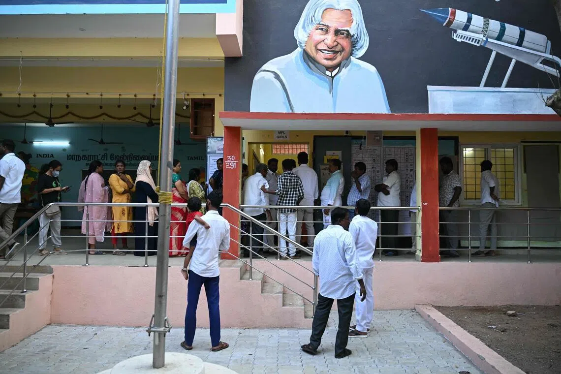 Voters queue to cast their vote outside a polling station during the 2026 Tamil Nadu Legislative Assembly elections in Chennai on April 23.