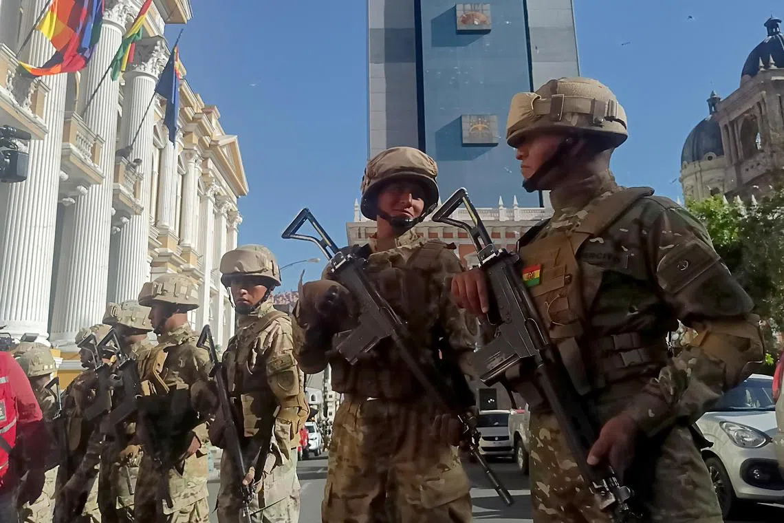 Soldiers stand in formation in front of Bolivia's government headquarters in La Paz. 