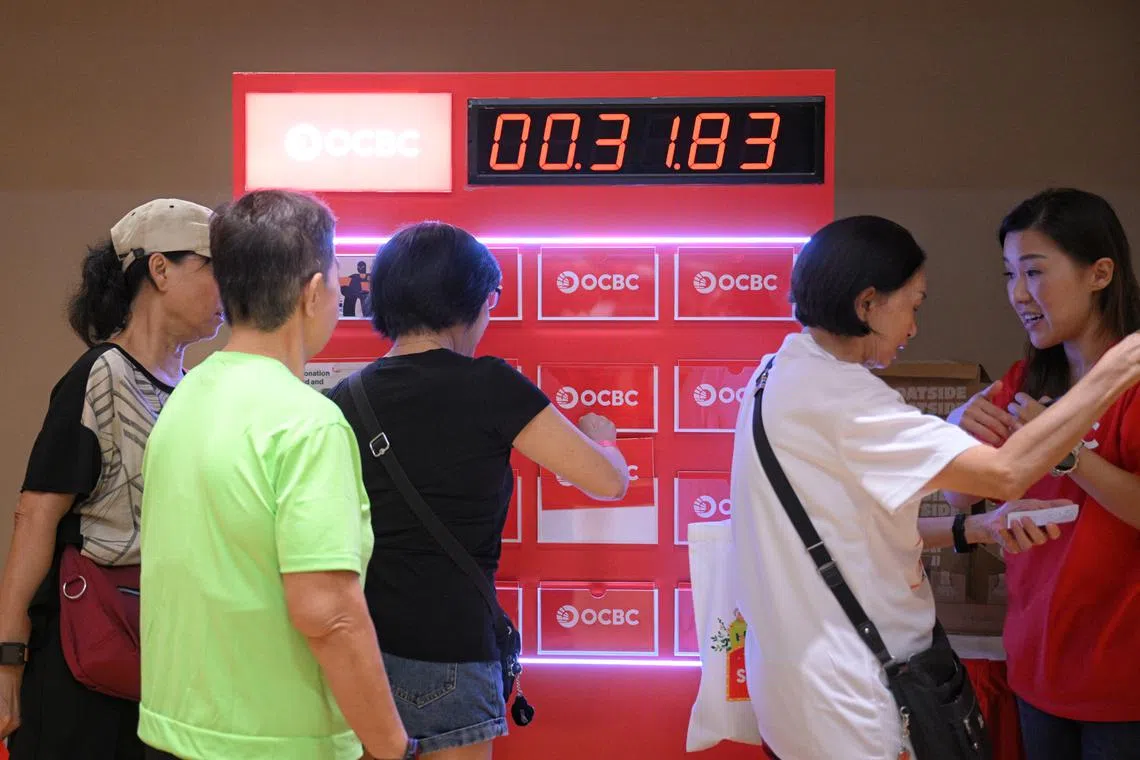 Residents playing a memory game during the launch of an OCBC programme at Bukit Canberra in Sembawang on March 29.
