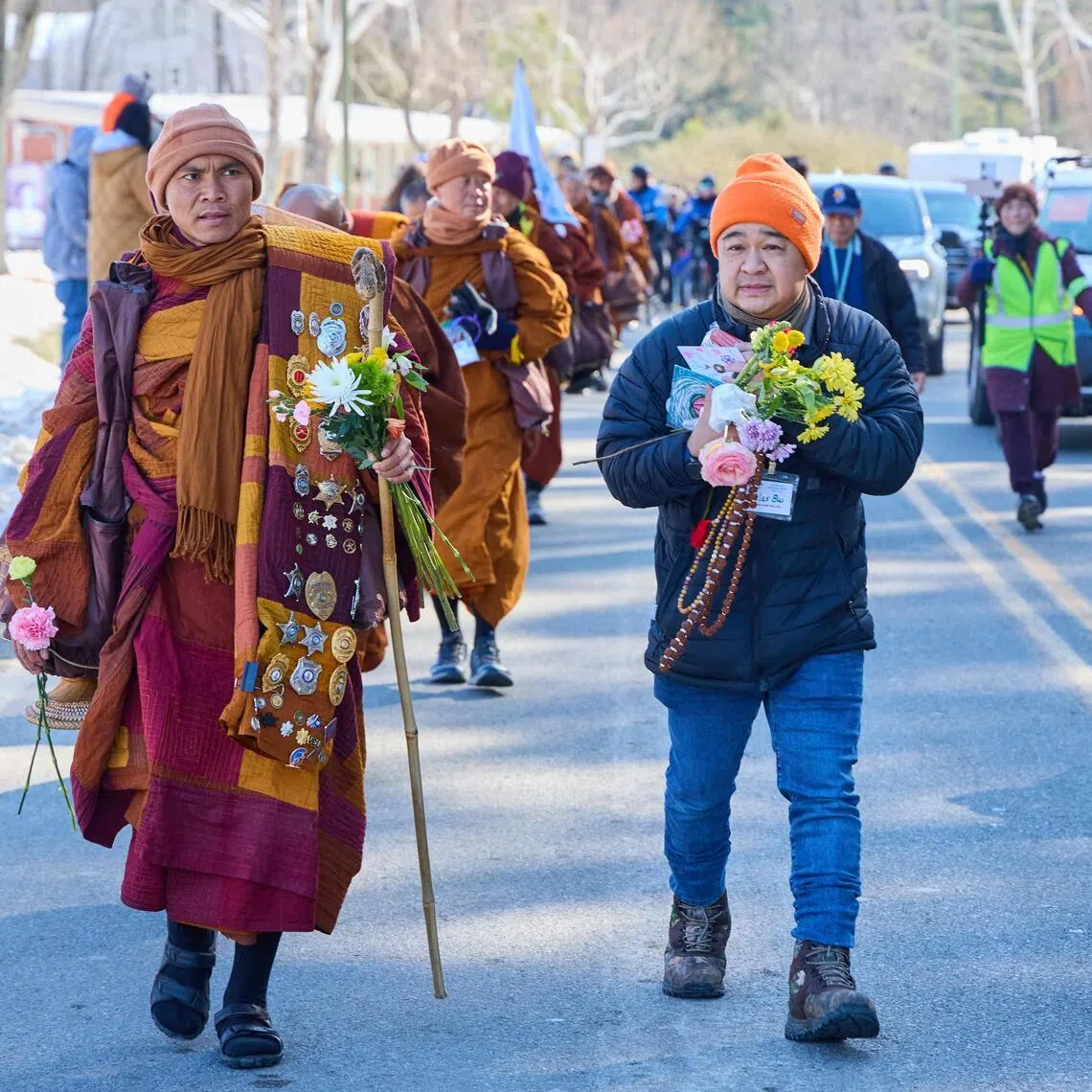 Led by Mr Bhikkhu Pannakara (left), Buddhist monks participate in a "Walk for Peace" in Glen Allen, Virginia, on Feb 3, 2026.