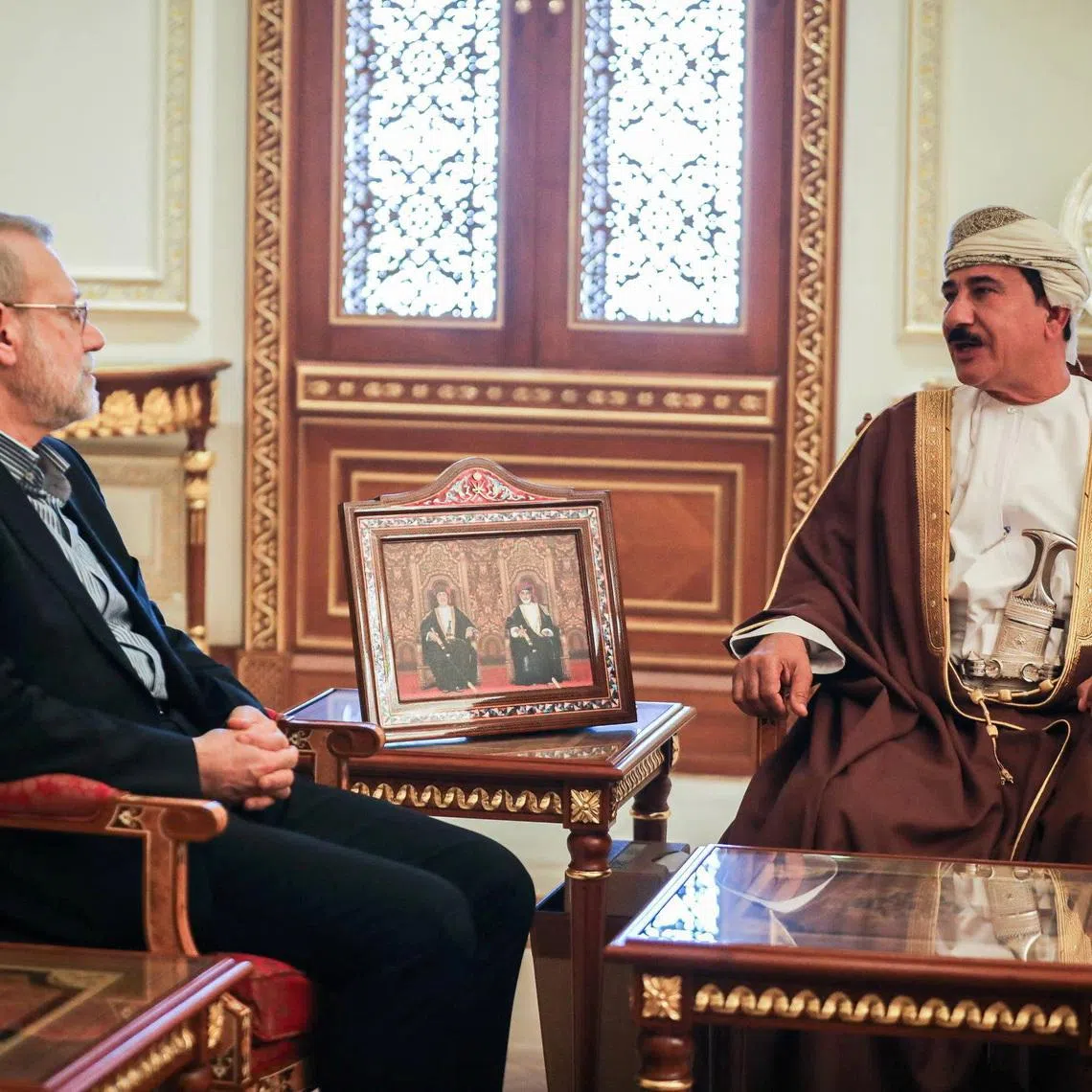 Secretary of the National Security Council, Ali Larijani meets with the Minister of the Royal Office in the Sultanate of Oman, Sultan bin Mohammed al Numani, in Muscat, Oman, February 10, 2026. Iran's National Security Council/WANA (West Asia News Agency)/Handout via REUTERS ATTENTION EDITORS - THIS PICTURE WAS PROVIDED BY A THIRD PARTY.
