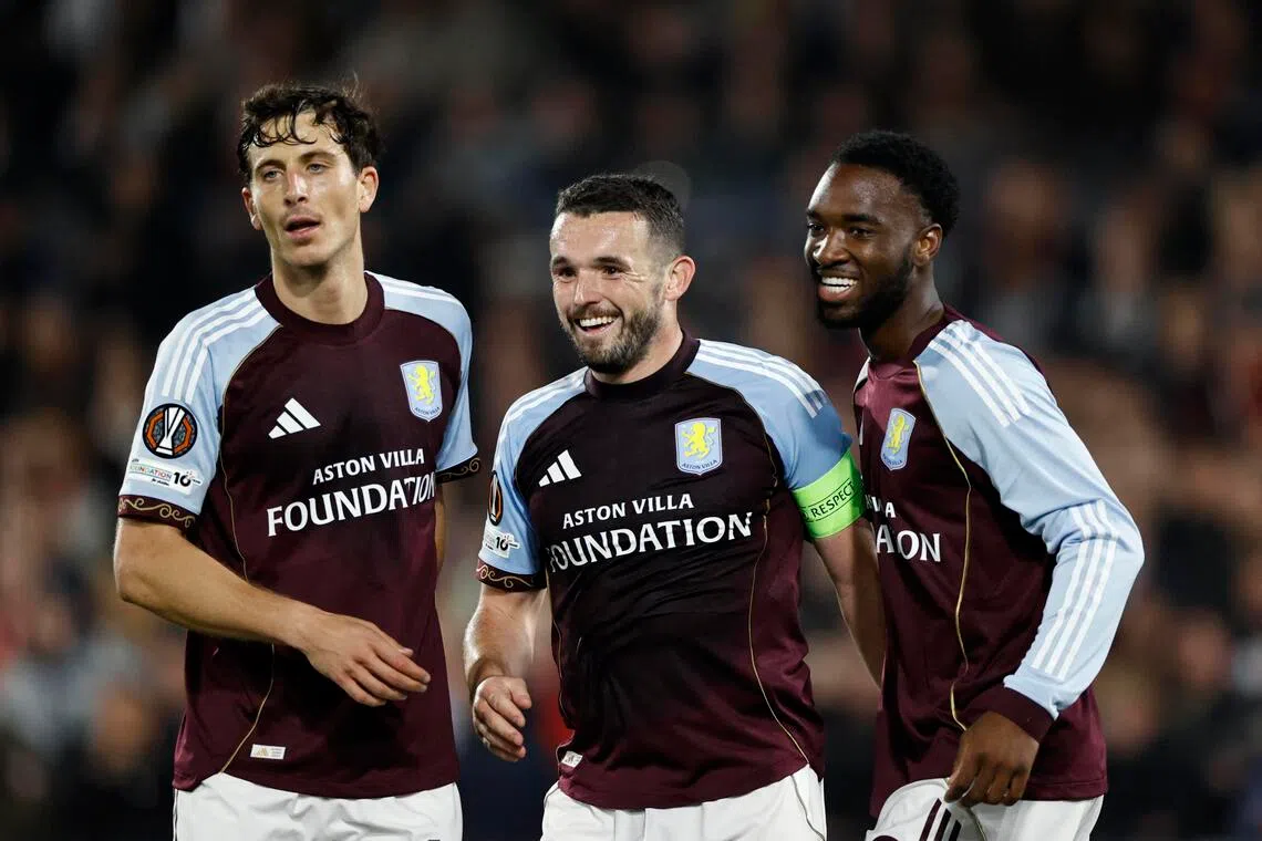 Aston Villa's John McGinn celebrates scoring their second goal with Pau Torres and Lamare Bogarde.