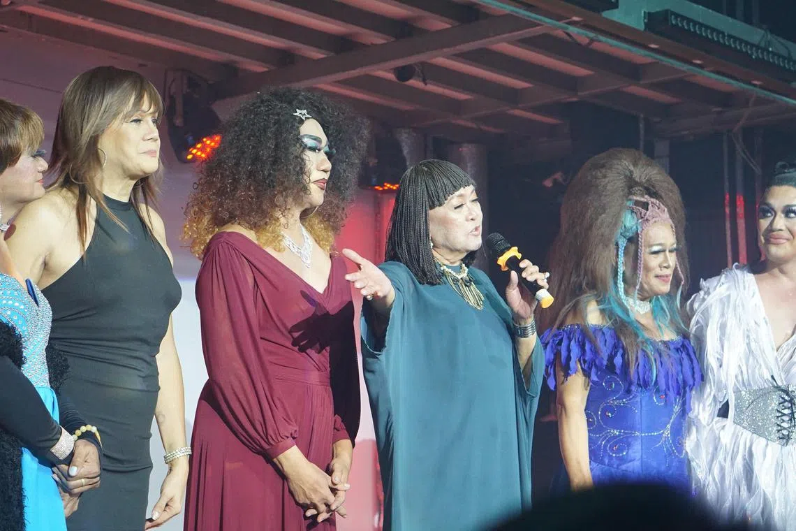 Drag Race Philippines Season 1 winner Precious Paula Nicole (1st from right) stands aside and gives the Golden Gays a chance to introduce themselves to the crowd at a late-night show at a gay bar in the Philippines on July 10, 2023.