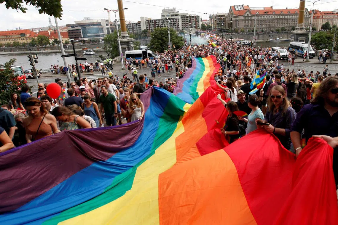 Participants hold a giant rainbow flag during the Prague Pride Parade where thousands marched through the city centre in support of gay rights, in Czech Republic, August 13, 2016.  REUTERS/David W Cerny/File Photo