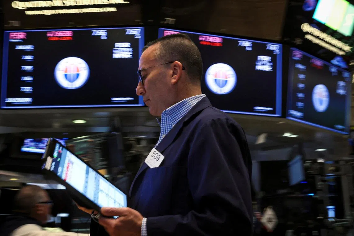 Traders work on the floor of the New York Stock Exchange.