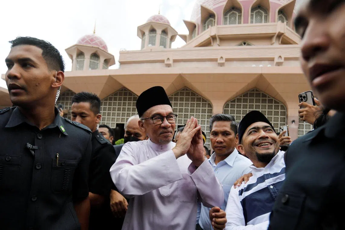 Newly elected Malaysia's Prime Minister Anwar Ibrahim meets supporters during his first public appearance, attending Friday prayer at a mosque in Putrajaya, Malaysia November 25, 2022. REUTERS/Hasnoor Hussain