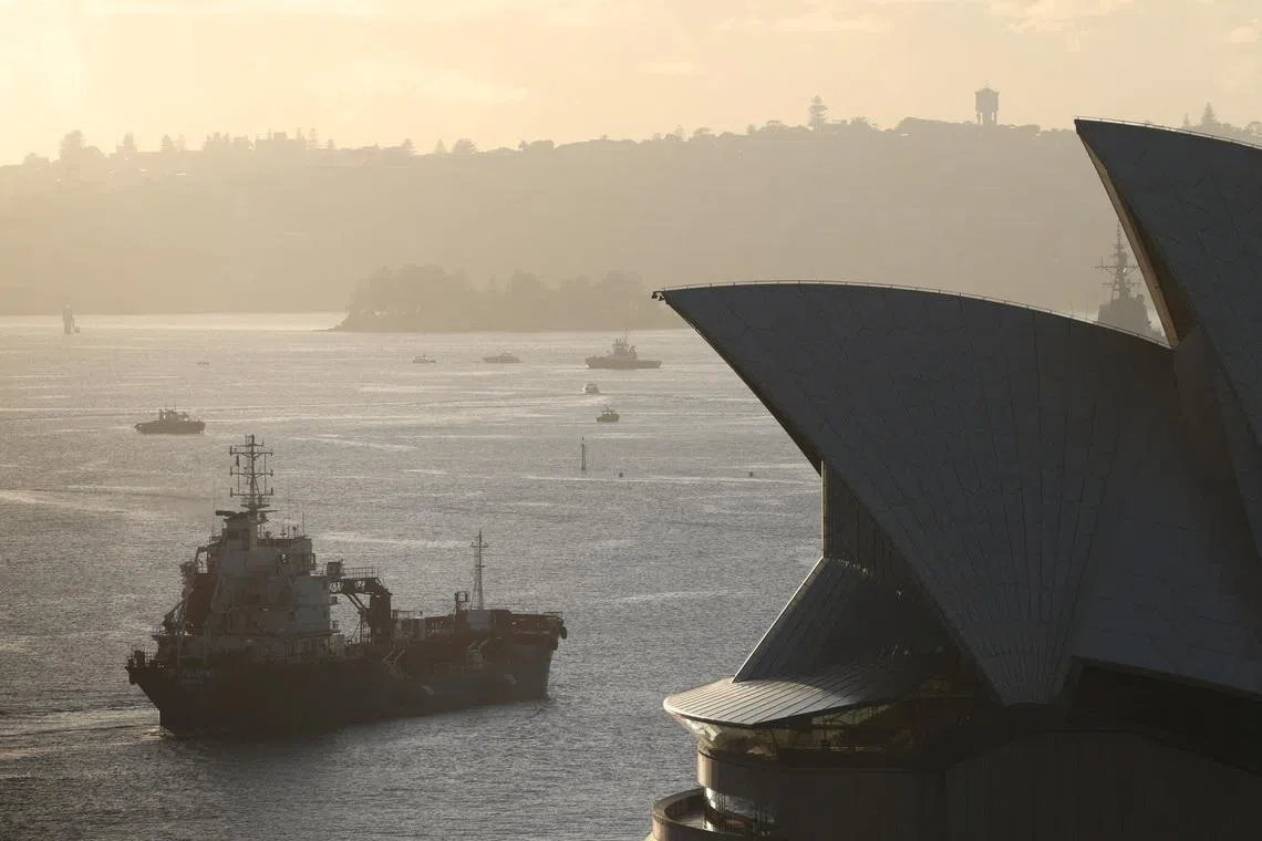 FILE PHOTO: An oil products tanker passes the Sydney Opera House at sunrise in Sydney, Australia, March 21, 2026. REUTERS/Hollie Adams/File Photo