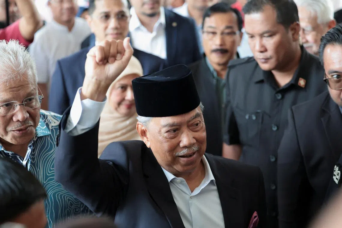 FILE PHOTO: Malaysian opposition leader and former premier Muhyiddin Yassin gestures as he arrives at the Gua Musang Sessions Court in Gua Musang, Malaysia August 27, 2024. REUTERS/Hasnoor Hussain/File photo