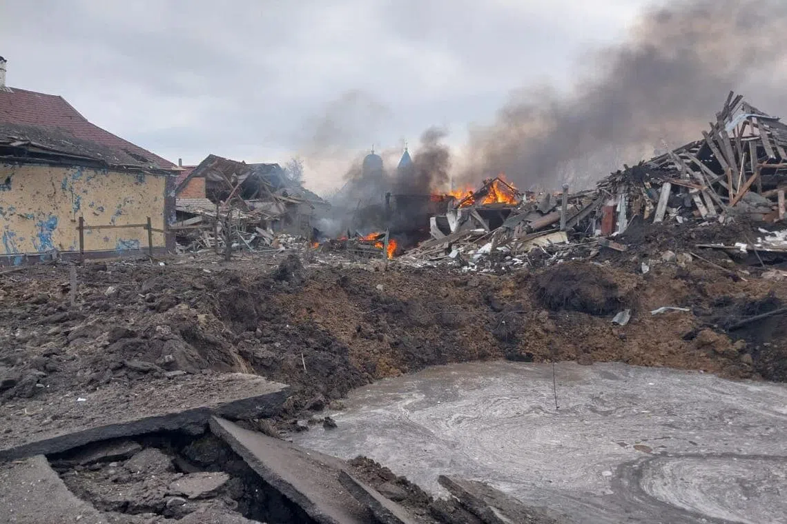 A view shows a bomb crater and residential buildings destroyed by a Russian air strike in the village of Borova, amid Russia's attack on Ukraine, in Kharkiv region, Ukraine March 6, 2024. Press service of the National Police of Ukraine in Kharkiv region/Handout via REUTERS