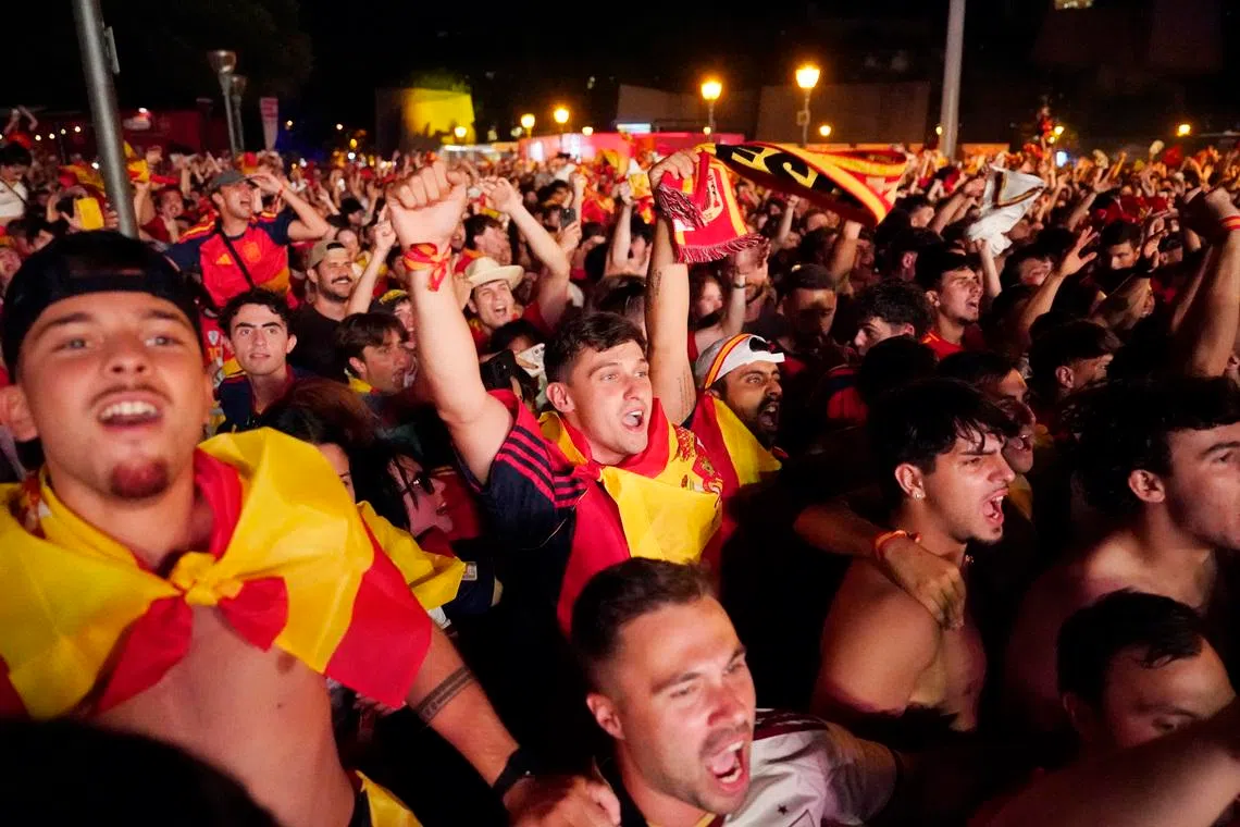 Spain fans celebrate in Madrid after Ferran Torres scored the winning goal in Madrid on July 19.