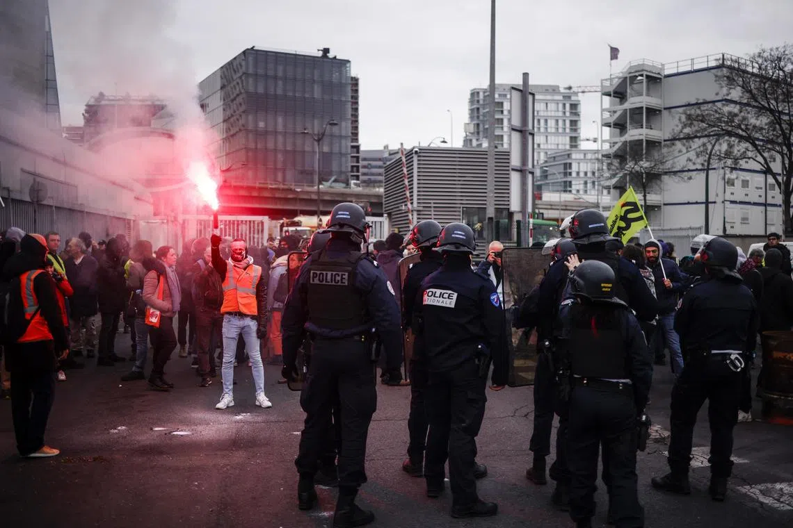 People protest against the pensions reform law in Ivry-sur-Seine, outside Paris, on March 27, 2023. 