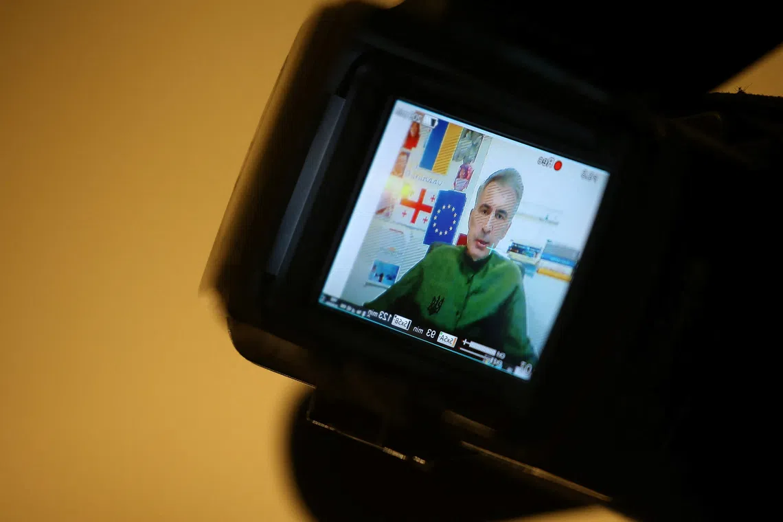 Georgia's jailed ex-President Mikheil Saakashvili is seen on a TV camera display during a court hearing in the case of the violent dispersal of anti-government mass protests in 2007, as he participates via video link from a clinic in Tbilisi, Georgia, October 27, 2023. REUTERS/Irakli Gedenidze/Pool