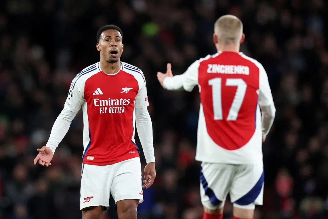 FILE PHOTO: Soccer Football - Champions League - Round of 16 - Second Leg - Arsenal v PSV Eindhoven - Emirates Stadium, London, Britain - March 12, 2025 Arsenal's Gabriel Magalhaes and Oleksandr Zinchenko REUTERS/David Klein/File Photo