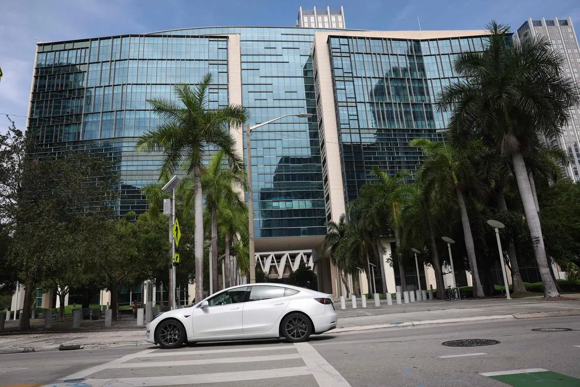 A Tesla car passing the US Courthouse in Miami, Florida, where the case is being heard.