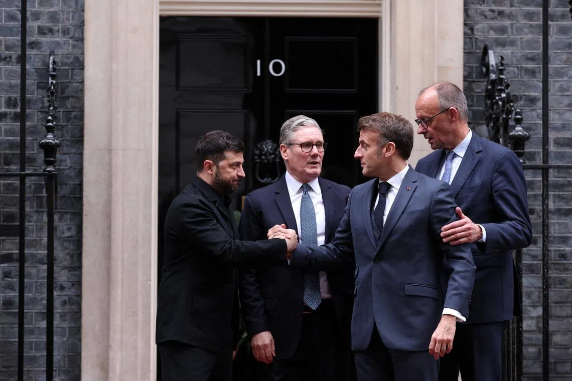 British Prime Minister Keir Starmer, Ukrainian President Volodymyr Zelenskiy, French President Emmanuel Macron, and German Chancellor Friedrich Merz chat outside 10 Downing Street following a meeting, in London, Britain, December 8, 2025.  ADRIAN DENNIS/Pool via REUTERS