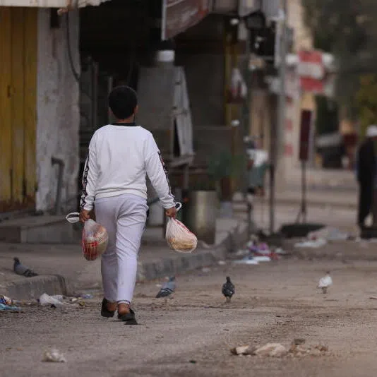 Residents during a military operation in the Palestinian village of Qabatiya, near the West Bank city of Jenin, on Dec 27.