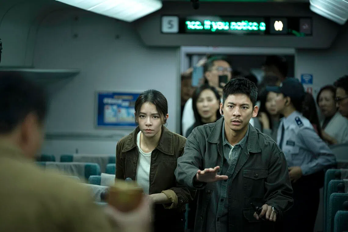 Actors Austin Lin (in foreground, right) and VIvian Sung (in foreground, left) played police officers in the disaster action movie 96 Minutes.
