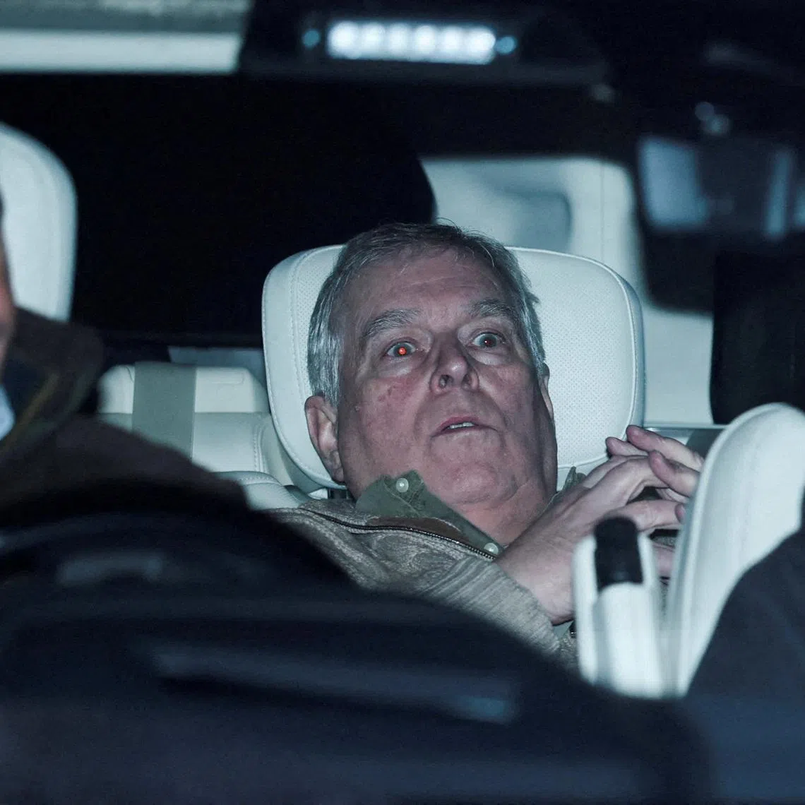 FILE PHOTO: Andrew Mountbatten Windsor, younger brother of Britain’s King Charles, formerly known as Prince Andrew, leaves Aylsham Police Station on a vehicle, on the day he was arrested on suspicion of misconduct in public office, after the U.S. Justice Department released more records tied to the late financier and convicted sex offender Jeffrey Epstein, in Aylsham, Britain, February 19, 2026. REUTERS/Phil Noble/File Photo