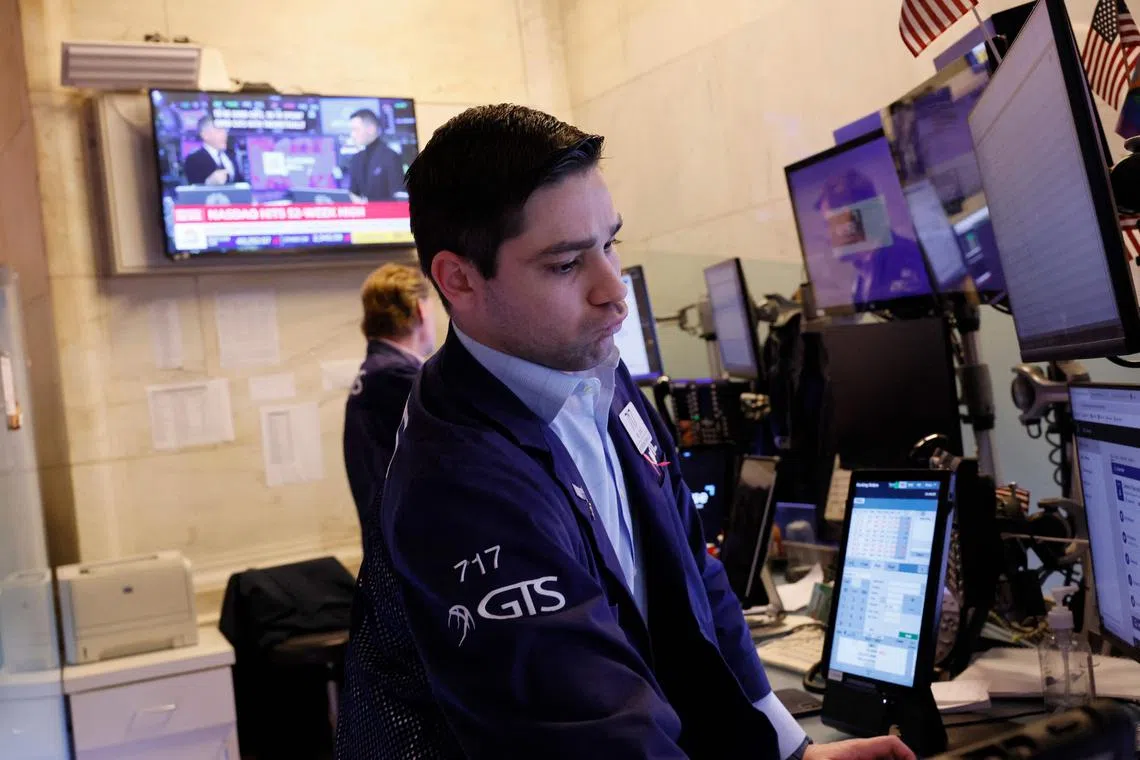 Traders work on the floor of the New York Stock Exchange, in New York City.