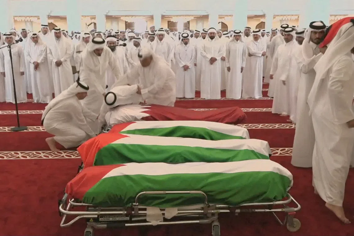 People attend a funeral on Sept 11 held for those killed by an Israeli attack in Doha on Sept 8.