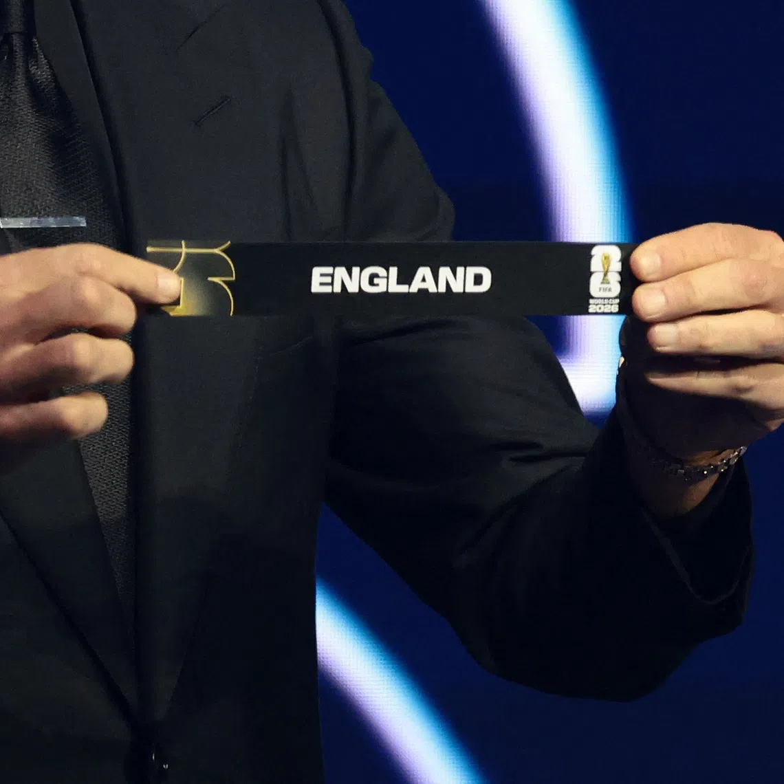 Soccer Football - FIFA World Cup 2026 - FIFA World Cup 2026 Draw - John F. Kennedy Center for the Performing Arts, Washington, D.C., U.S. - December 5, 2025 Draw Assistant Tom Brady draws England during the draw REUTERS/Evelyn Hockstein