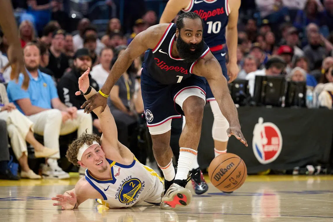 LA Clippers guard James Harden controls the ball against Golden State Warriors guard Brandin Podziemski during the fourth quarter at Chase Centre.