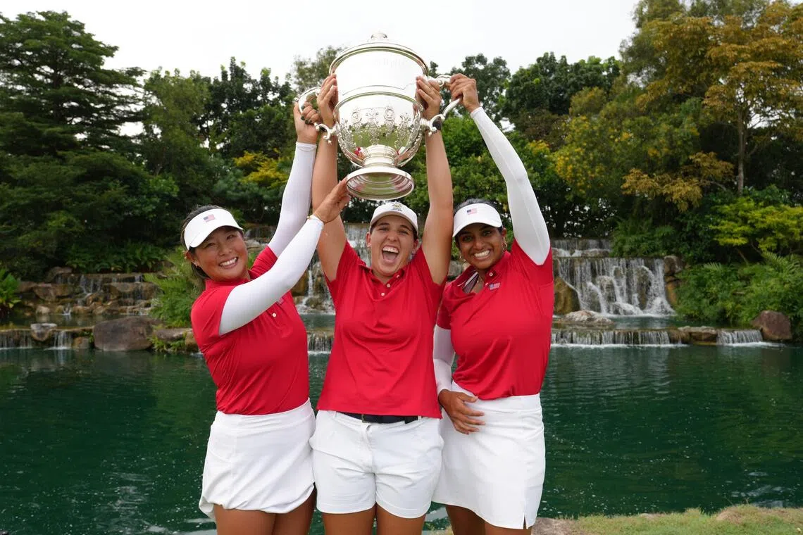 (From left) Catherine Park, Farah O'Keefe and Megha Ganne lifting the Espirito Santo Trophy after winning the World Amateur Team Championships women’s competition.