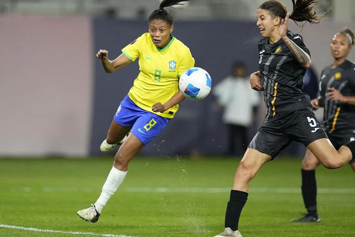 Feb 21, 2024; San Diego, California, USA;  Brazil forward Ary Borges (8) battles for the ball against Puerto Rico defender Madison Cox (5) during the first half of the 2024 Concacaf W Gold Cup group B stage match at Snapdragon Stadium. Mandatory Credit: Ray Acevedo-USA TODAY Sports