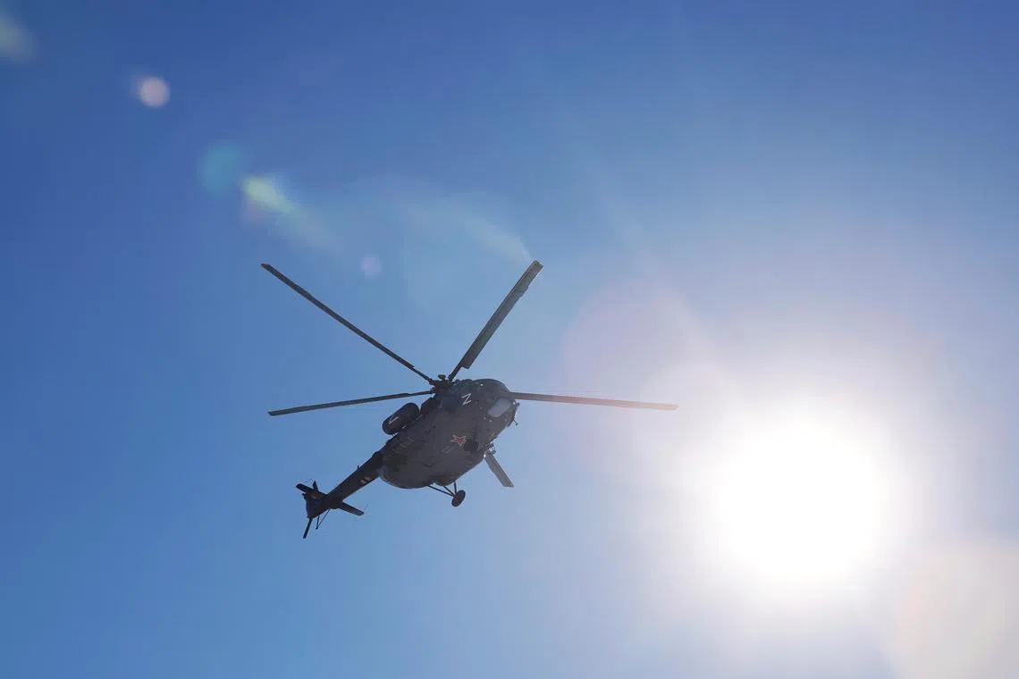 FILE PHOTO: A Russian Mi-8 military helicopter flies in the sky, in the course of Russia-Ukraine conflict in the Donetsk Region, Russian-controlled part of Ukraine, February 21, 2025. REUTERS/Alexander Ermochenko/File Photo