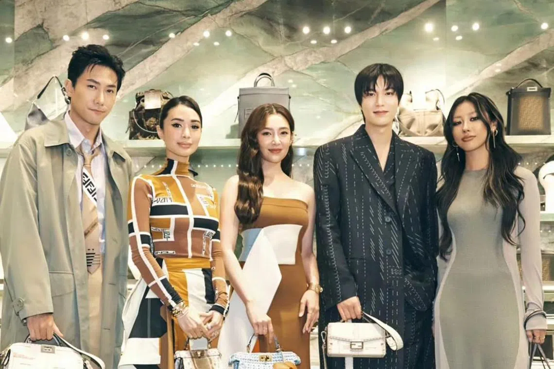(From left) Local actor Desmond Tan, Filipino actress Heart Evangelista, Thai actress Bella Ranee Campen, South Korean actor Lee Min-ho and Singapore influencer Mae Tan at the opening of Fendi Siam Paragon Men Boutique in Bangkok.
