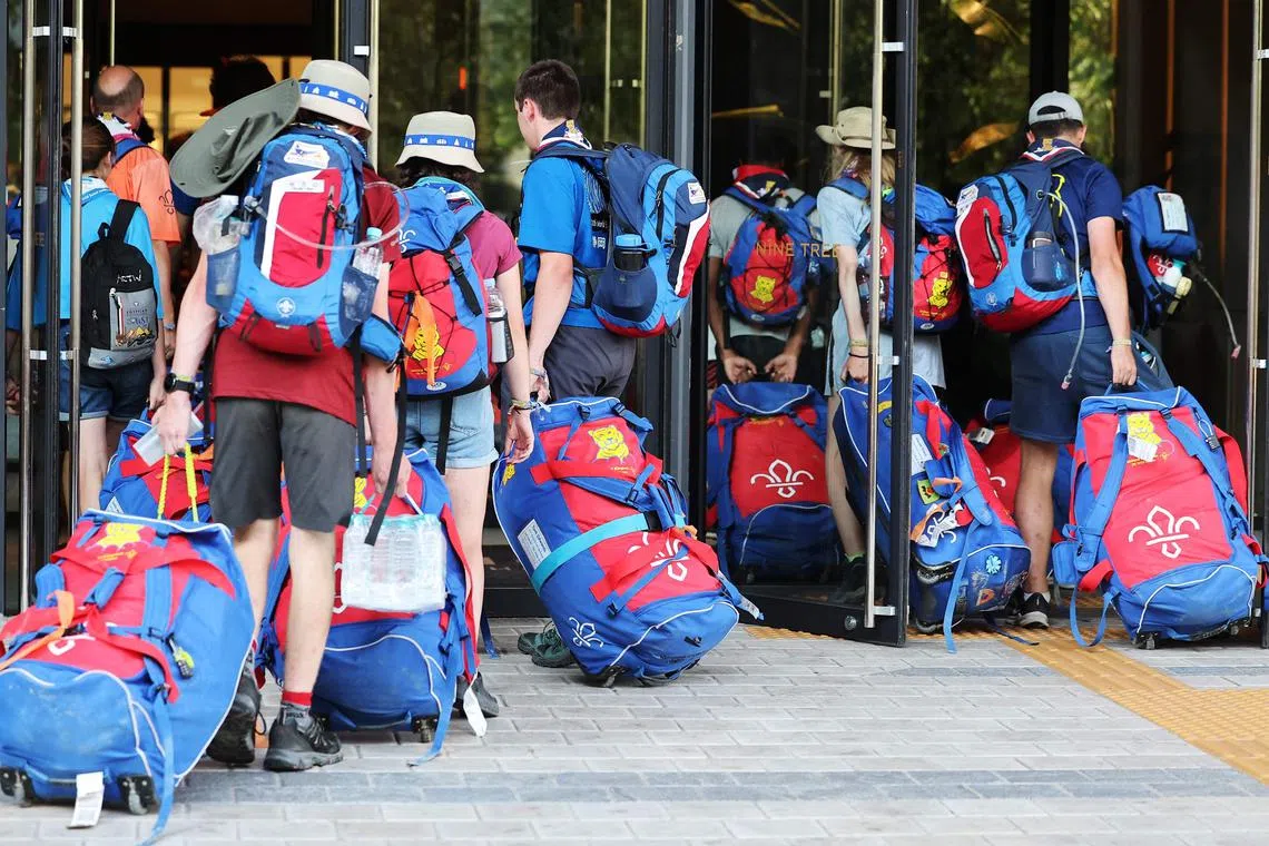 Each British scout, seen here heading for a hotel, spent around £3,500 (S$5,976) on the trip.