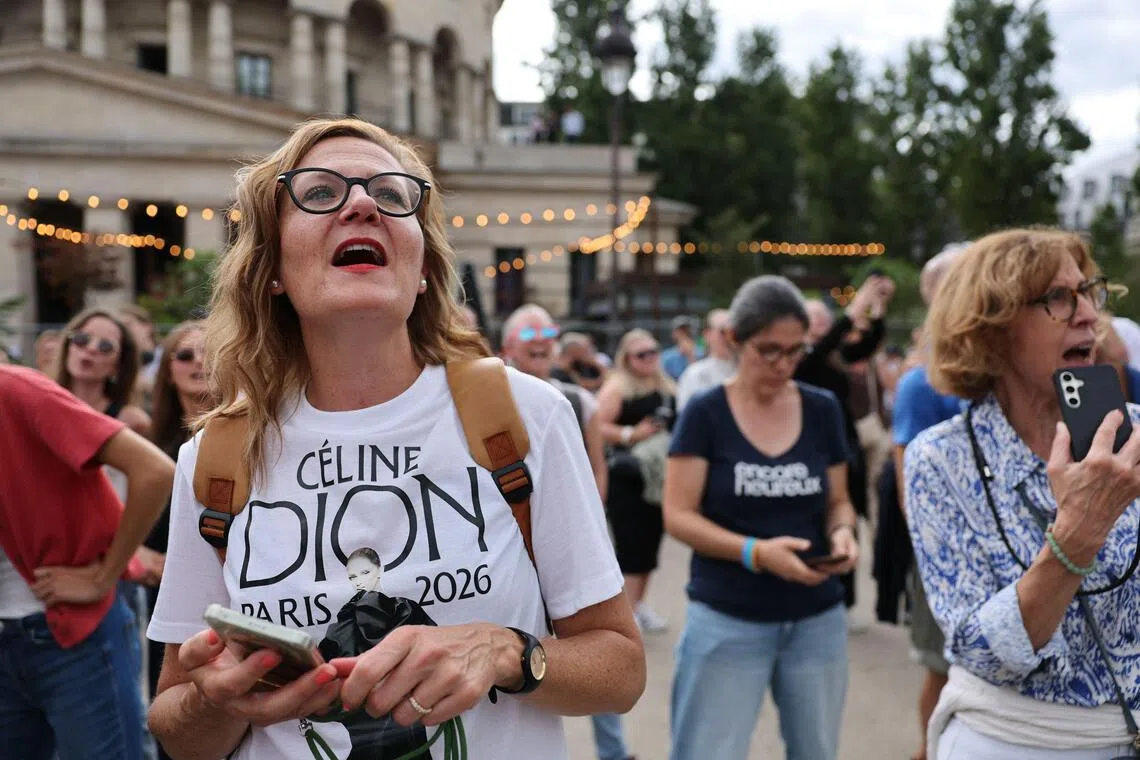 Fans of Celine Dion at a singalong event in her honour in Paris on Sept 12.