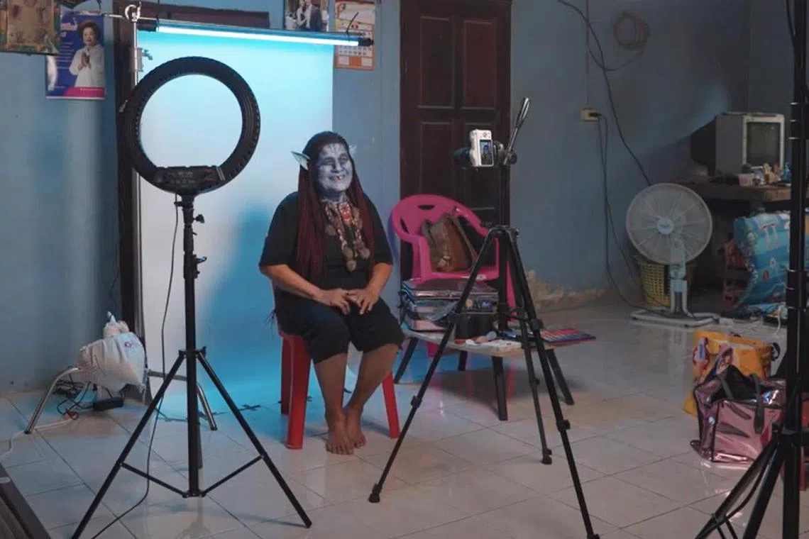 hyletter - Screengrab. A screengrab of a commercial advertising Five Star chicken, showing how elderly Thai people started broadcasting on Tiktok to get the attention of their children or grandchildren whom they missed. Credit: BBDO Asia/Youtube