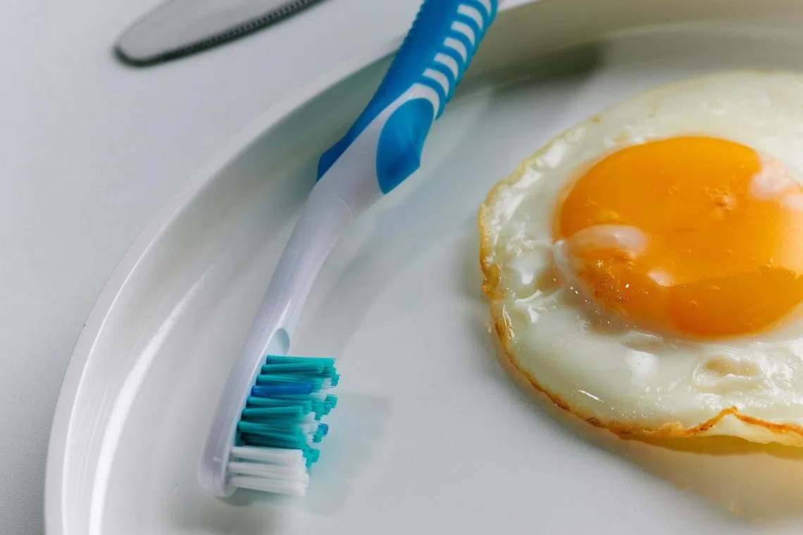 The fluoride from your toothpaste will work better throughout the day if it is not displaced by chewing food right after you brush.