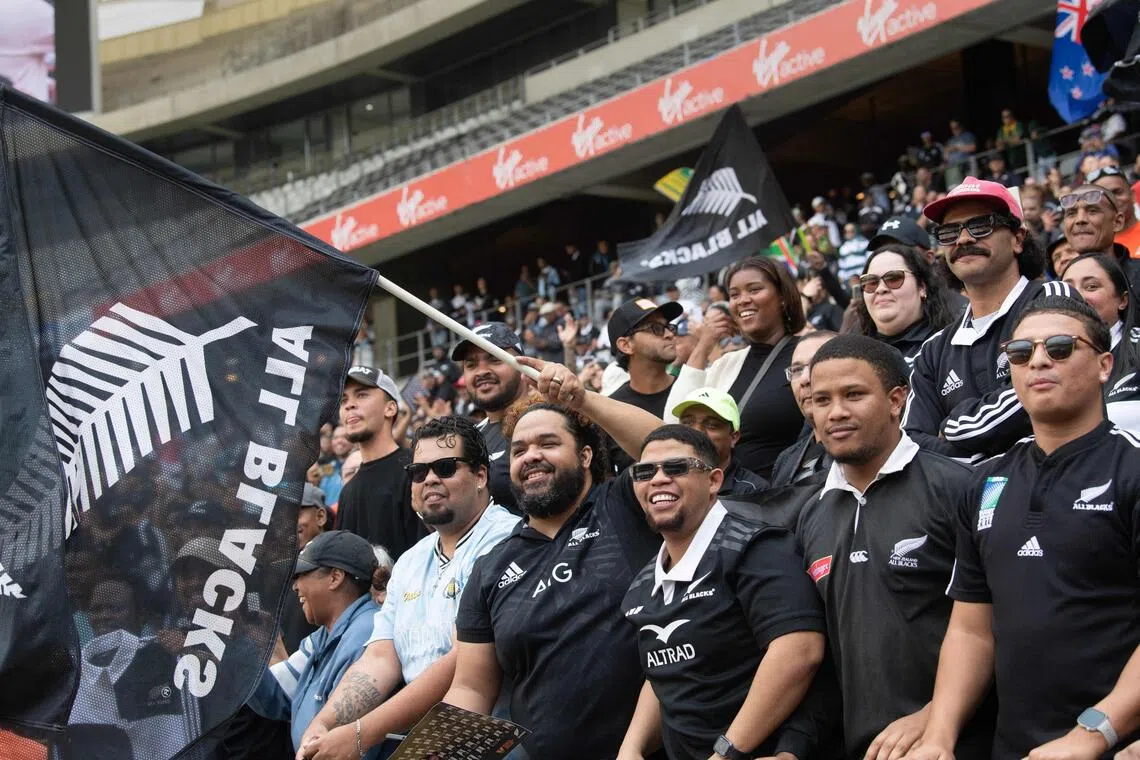 All Blacks fans cheering during the New Zealand national rugby team’s “Welcome to Country” event at the Cape Town Stadium on July 31.